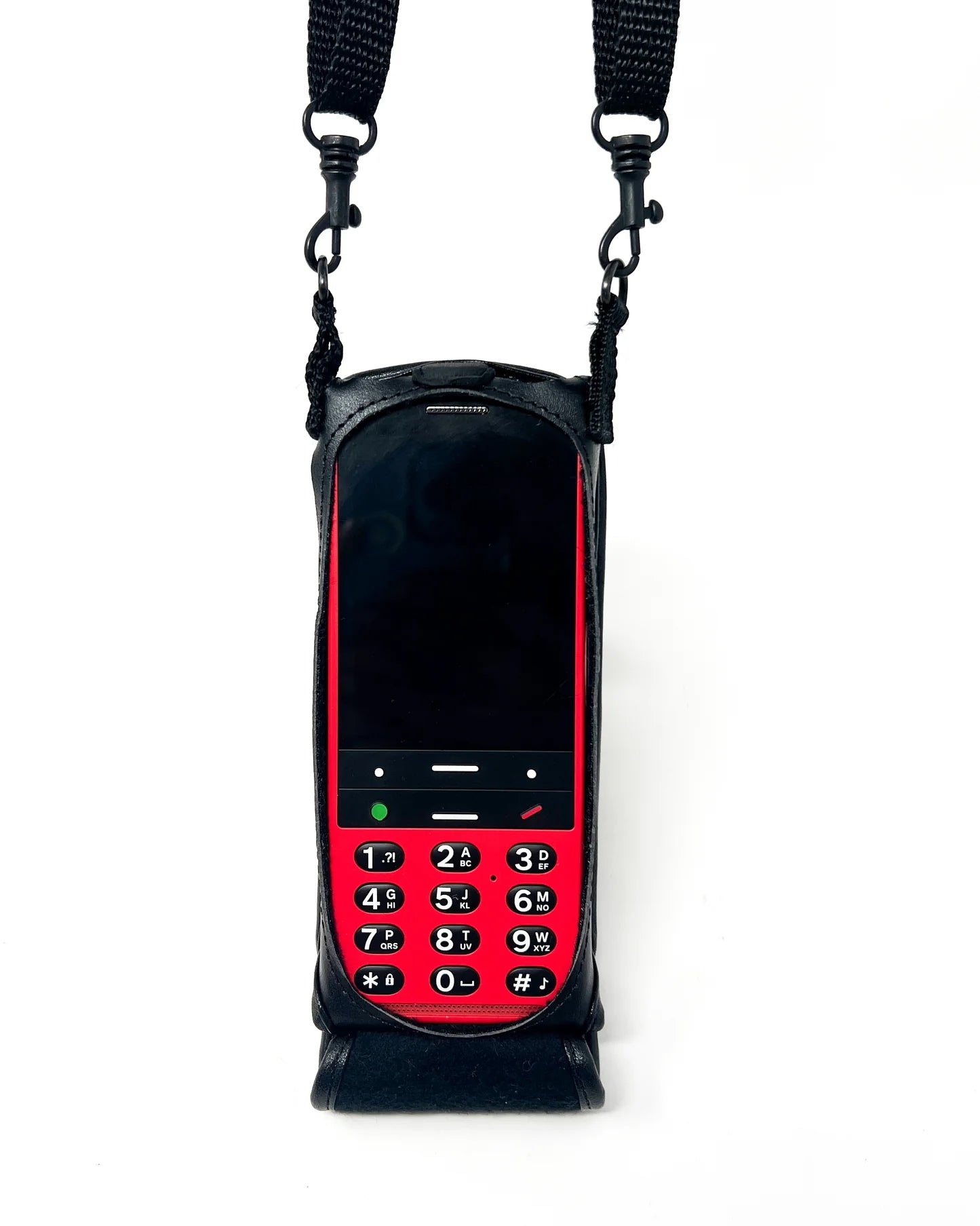 The Turtleback black fitted leather case, snugly fitting around a red-fronted BlindShell phone, the device's screen and buttons visible.