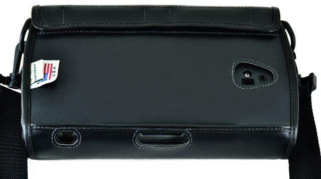The black leather case. It features a fitted design, a carrying strap, and a fold-over flap that settles over the device. There are multiple openings for each of the controls and ports visible.
