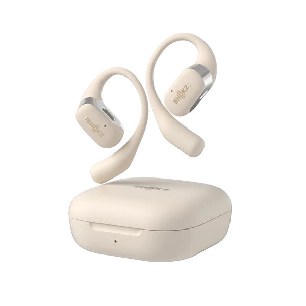 Beige Shokz OpenFit wireless earbuds floating above their matching charging case.