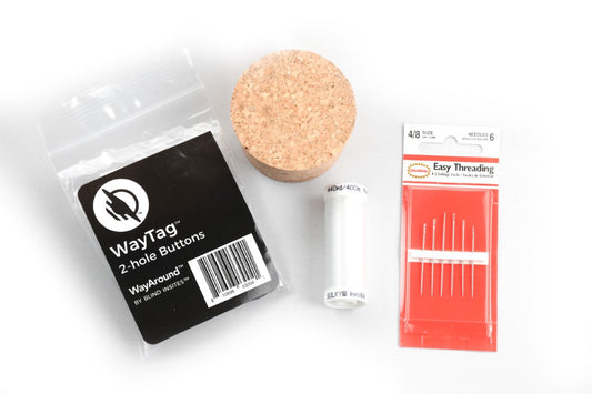 A neatly arranged group of sewing and accessibility items.