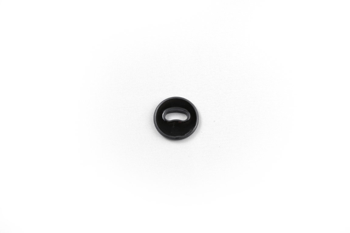 A singular black/dark gray oval-shaped button, with one ovular hole in the center.