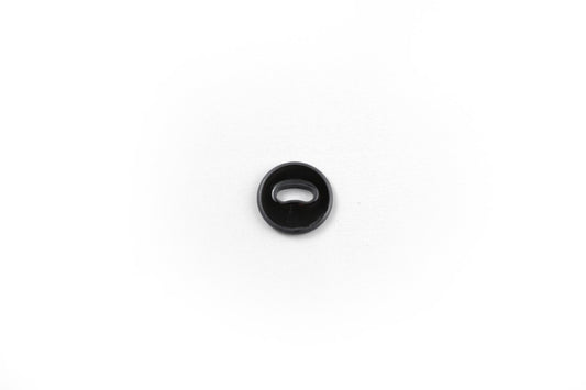 A singular black/dark gray oval-shaped button, with one ovular hole in the center.