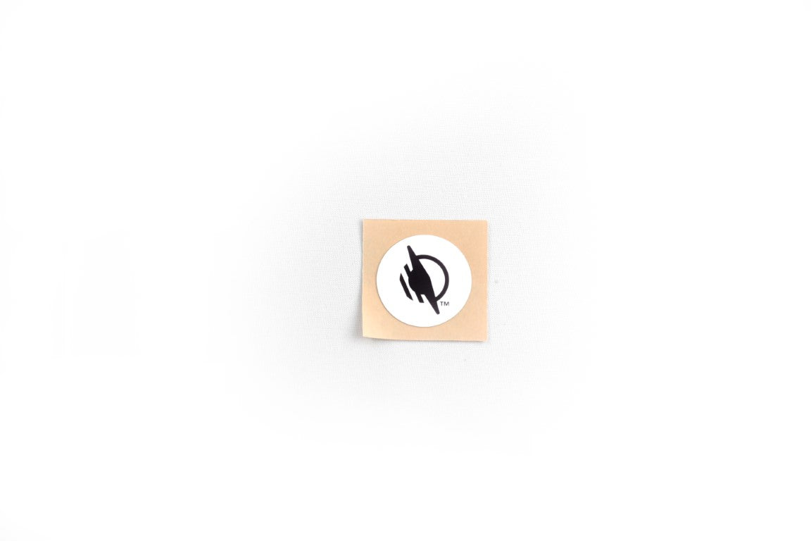 A singular square/rectangular WayTag sticker with rounded corners. The sticker has a light tan/beige background, and features the WayAround logo in the center.