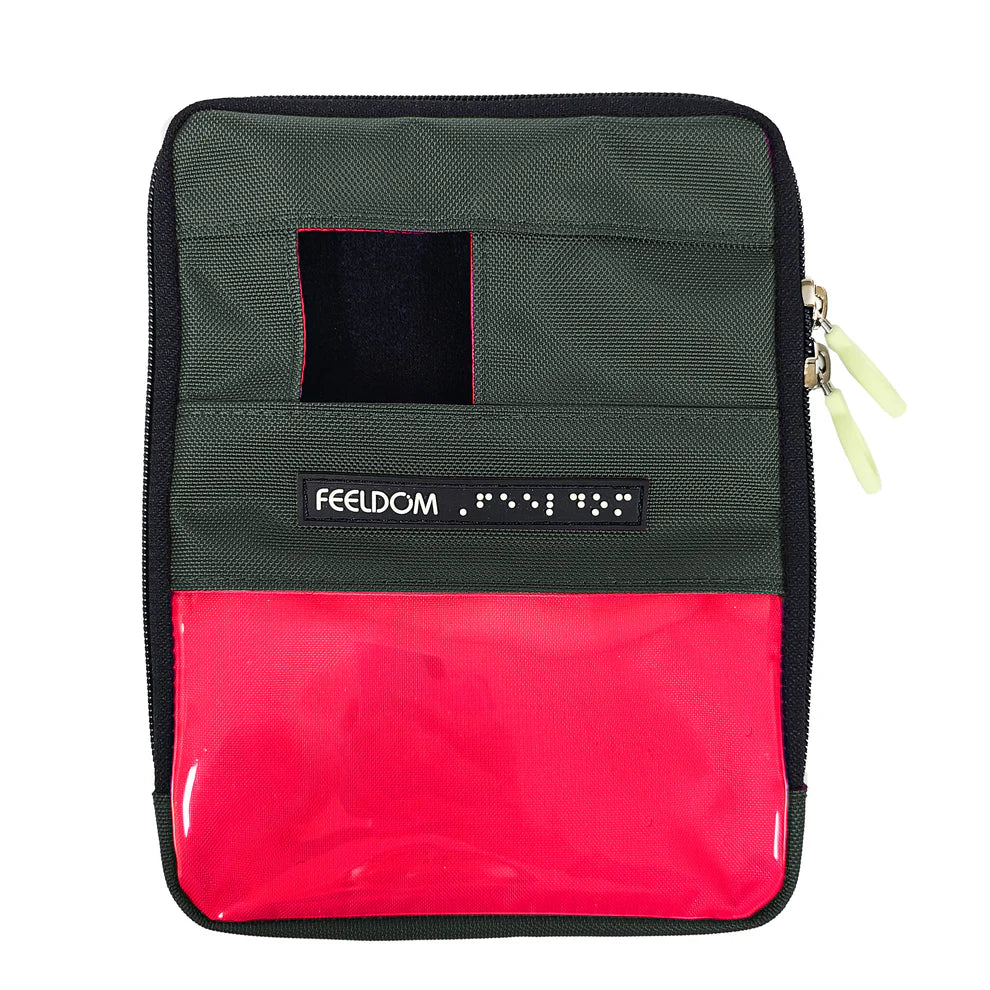 Front view of a gunmetal gray zippered pouch with a small square phone camera window at the top and a clear plastic 3 by 5 inch badge window on the lower half. The badge area is lined in neon red. A Feeldom label sits below the camera window, and two light-colored zipper pulls are along the right edge.