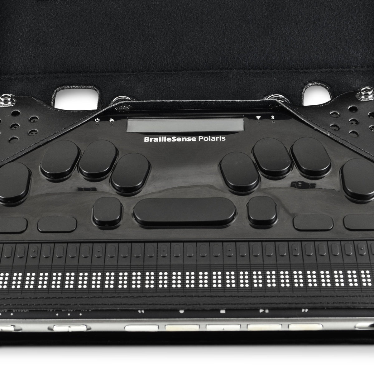 Close-up of the BrailleSense Polaris braille keyboard and display accessible inside the case, with leather corner guards and front controls exposed.
