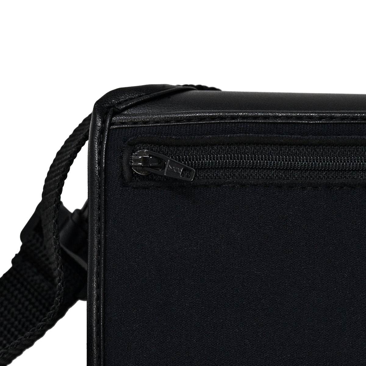 Close-up of the Brailliant BI 40X case's black zippered pocket, with the strap attachment visible at its corner.