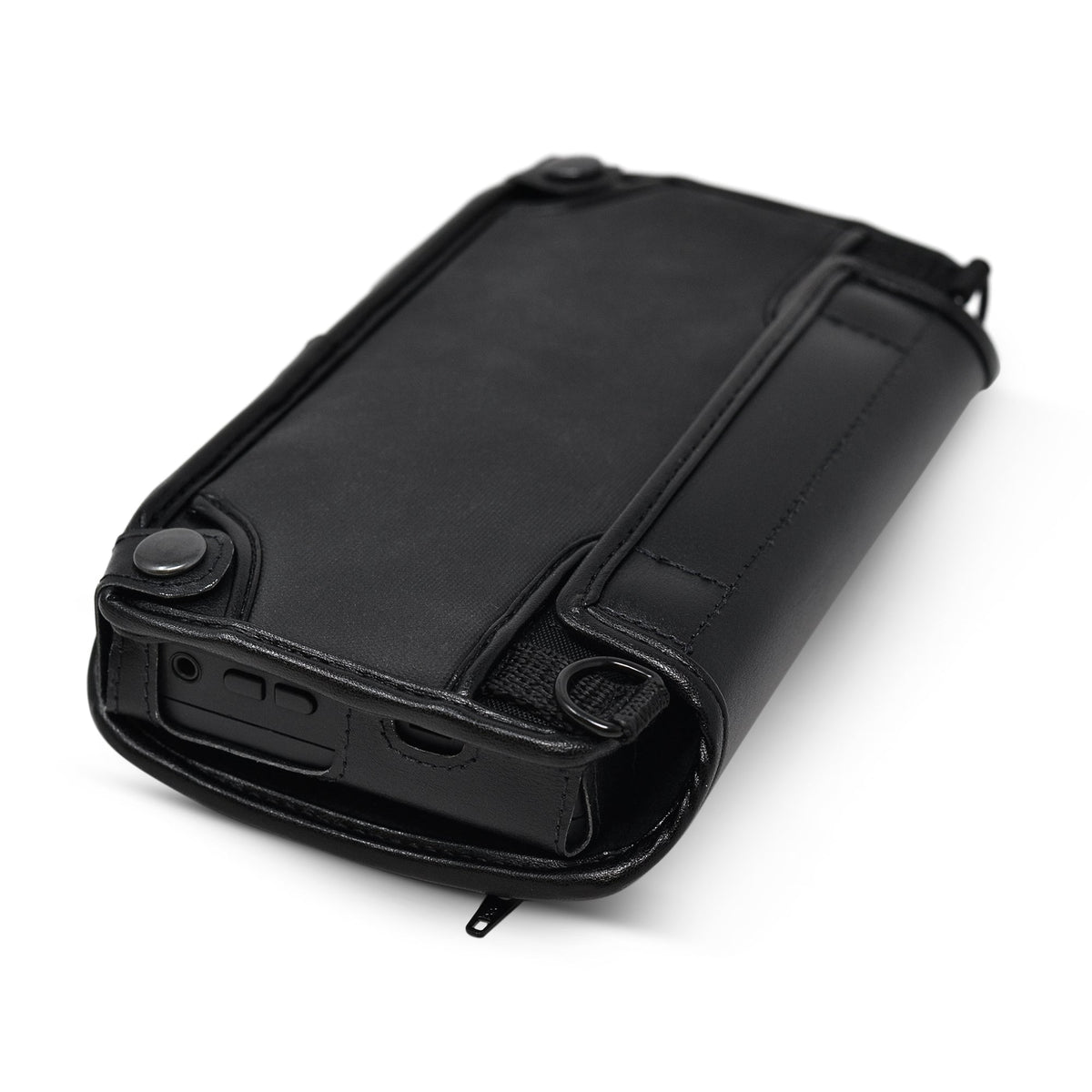 Angled view of the Brailliant BI 20X case from the opposite side, with snap-fastened leather straps and accessible device controls.