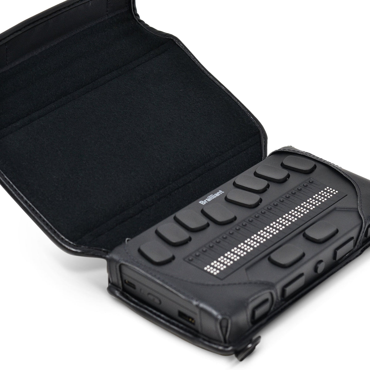Close-up of the braille display secured in the open Brailliant BI 20X case, showing its navigation keys and protected corners.