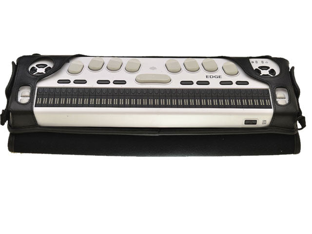 Selvas Braille Edge 40 display secured inside the open black Turtleback case, with its gray input keys, braille cells and end controls accessible above the folded cover.