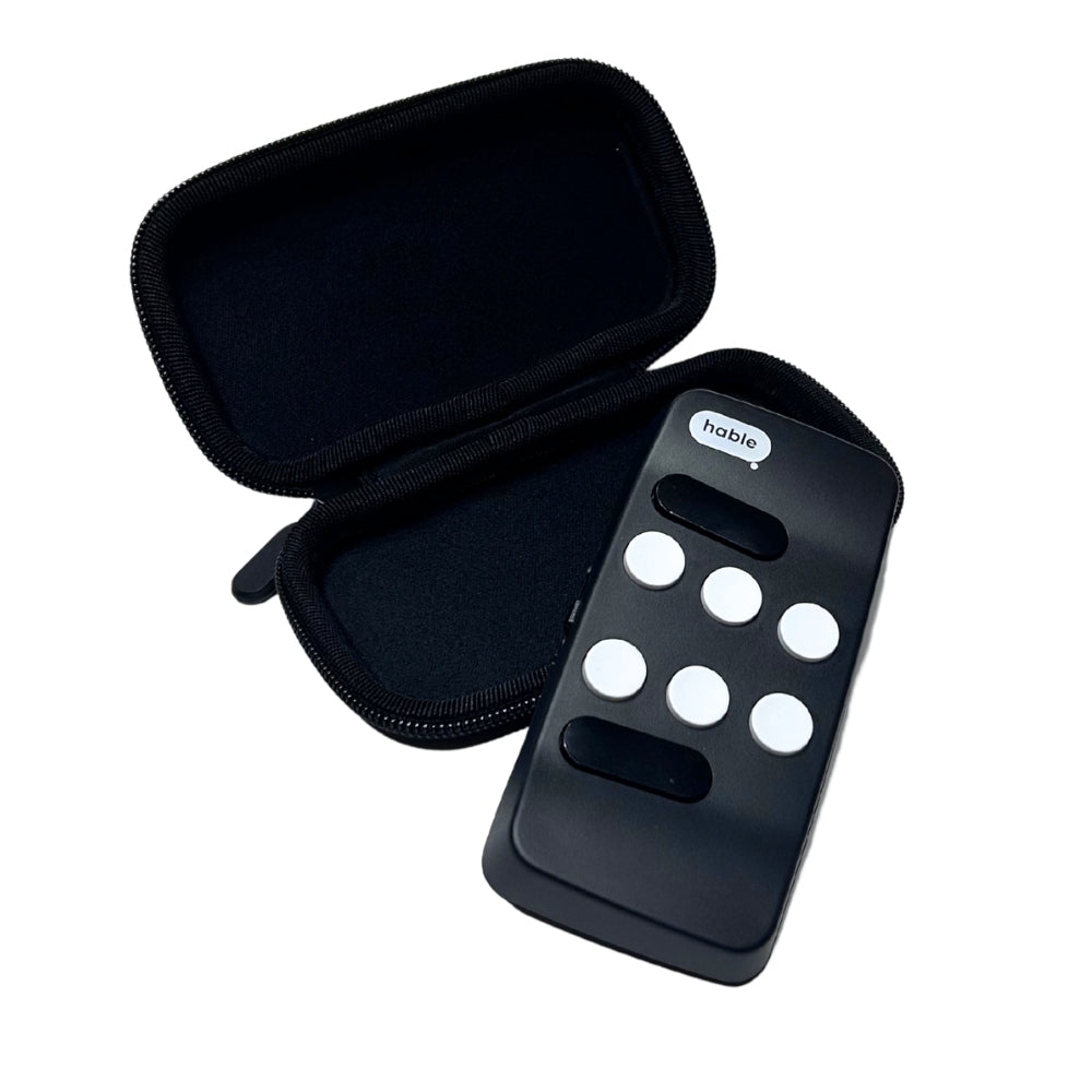 Open black Hable Carry Case beside a Hable Easy controller, showing the soft-lined interior and zippered shell.