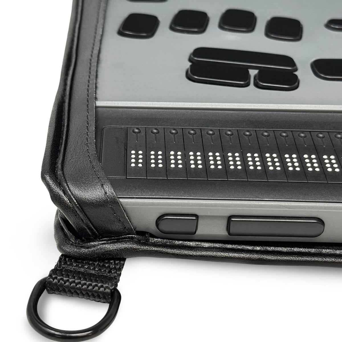 Close-up of the BrailleNote Evolve left front controls and braille cells, showing how the leather case leaves the buttons accessible.