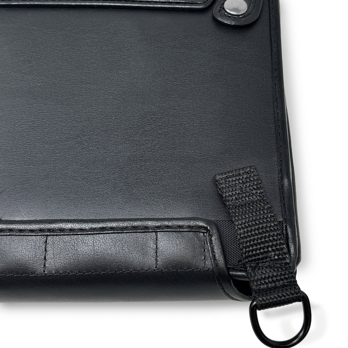 Close-up of the rear leather panel, stitching and woven strap loop on the BrailleNote Evolve case.