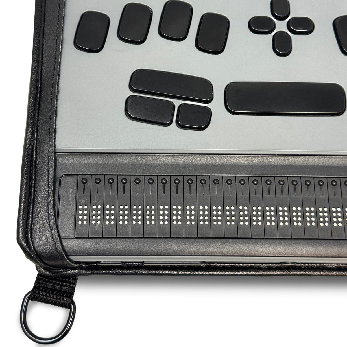 Close-up of BrailleNote Evolve controls and braille display seated in the fitted Turtleback case with a black strap attachment ring.
