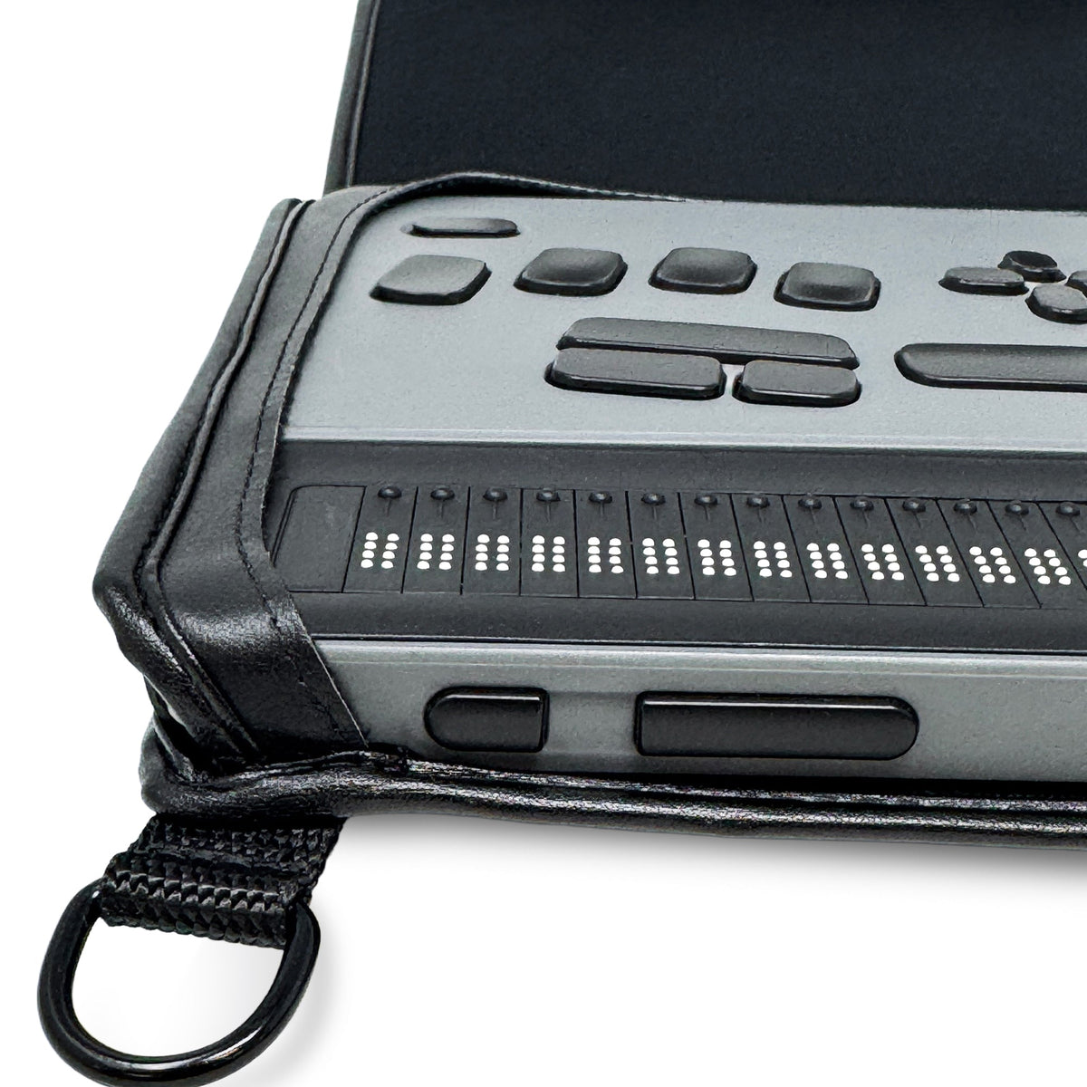 Angled close-up of the BrailleNote Evolve display and controls inside the case, showing its fitted corner and carrying ring.