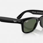Three-quarter rear view of the black_green Meta Ray Ban Smart Glasses. The outer temples with Ray‑Ban logos and the inside of one arm with small white sizing and product text are visible against a light background.