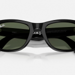 Back view of the black-green Meta Ray Ban Smart Glasses. The arms are slightly folded, and the bridge and rims are visible.