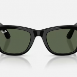 Front view of the black_green Meta Ray Ban Smart Glasses, the arms partially open against a light background