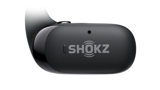Black Shokz OpenFit 2 earbud on a solid black background