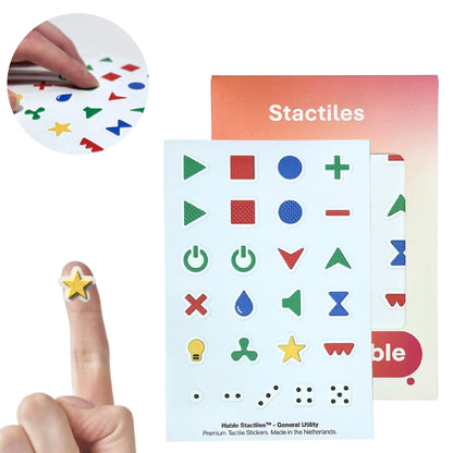 Stactiles General Utility tactile sticker sheet with 25 colorful appliance symbols, shown with Hable packaging and a sticker on a fingertip.