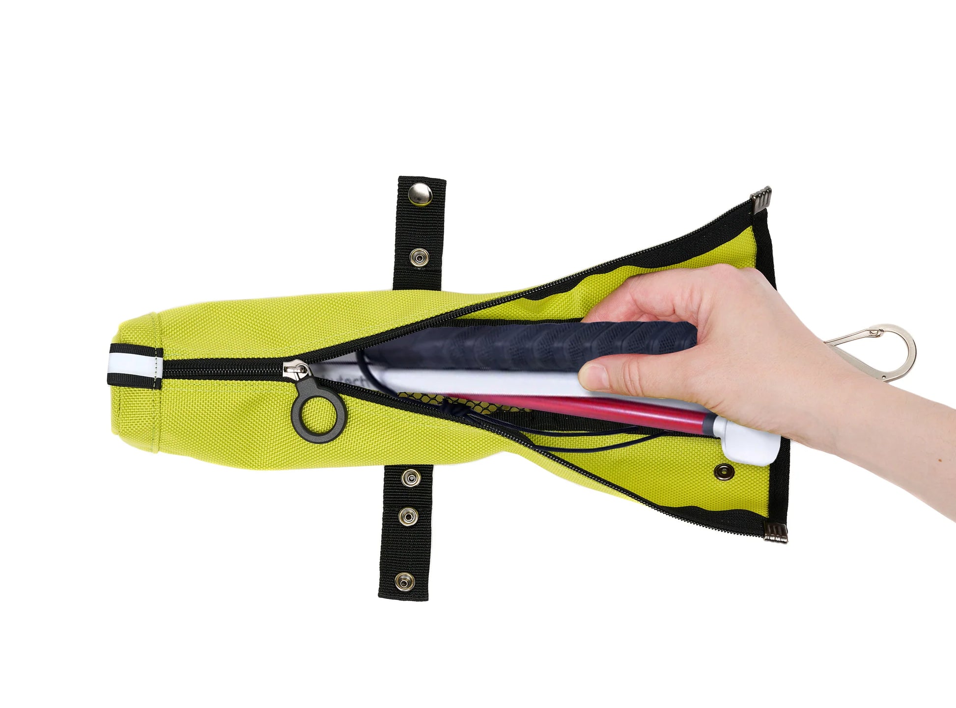 An unzipped cane pouch and a folded up cane inside. A hand is reaching in. The adjustable strap is unsnapped.