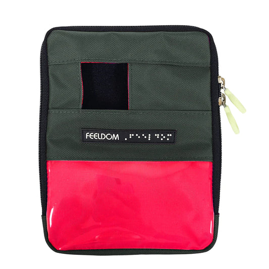 Front view of a gunmetal gray zippered pouch with a small square phone camera window at the top and a clear plastic 3 by 5 inch badge window on the lower half. The badge area is lined in neon red. A Feeldom label sits below the camera window, and two light-colored zipper pulls are along the right edge.